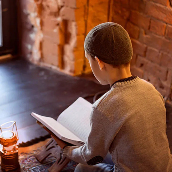 boy learn quran with teacher